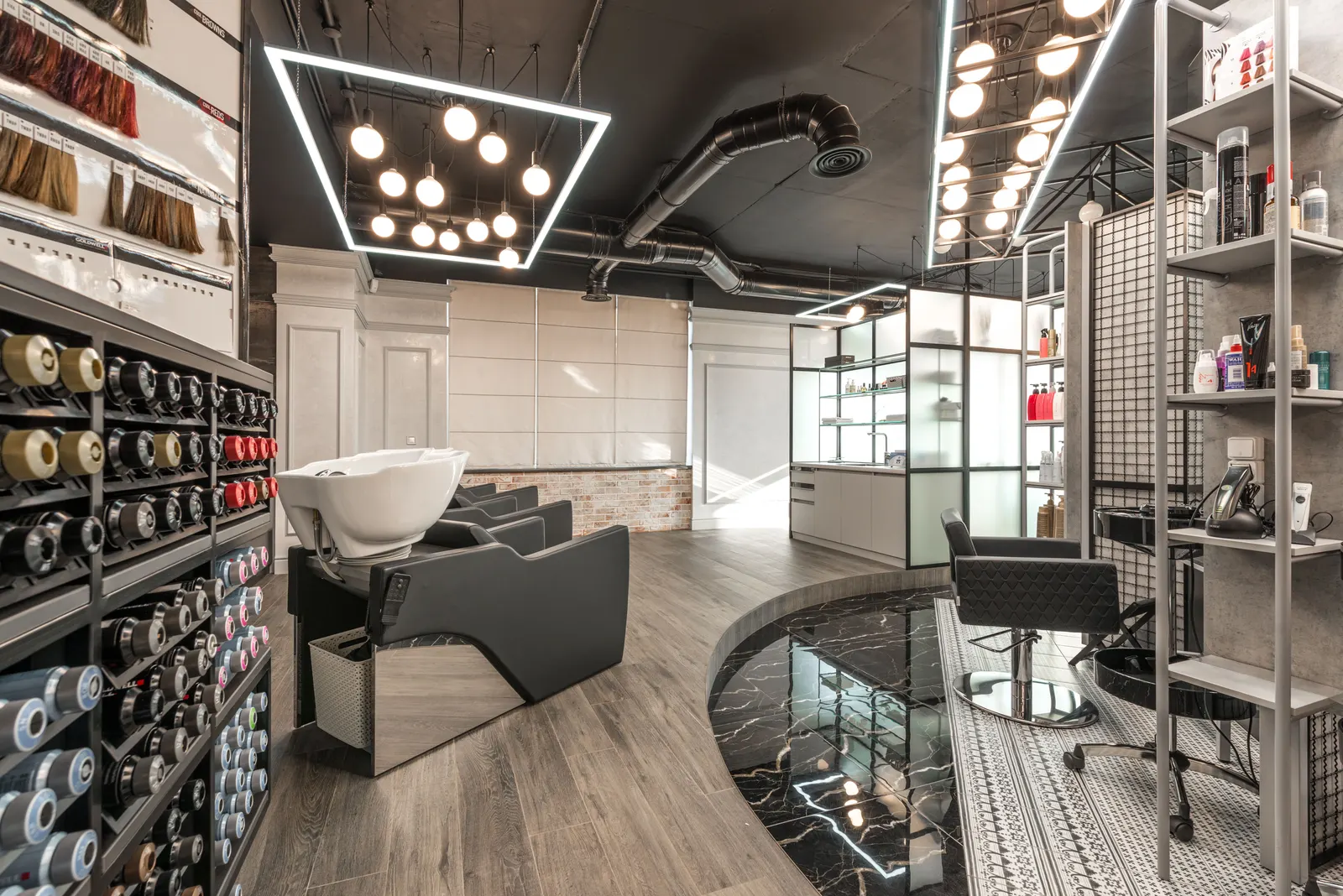 A fitted-out salon floor with wash stations and styling chairs, ready for professionals to move in.